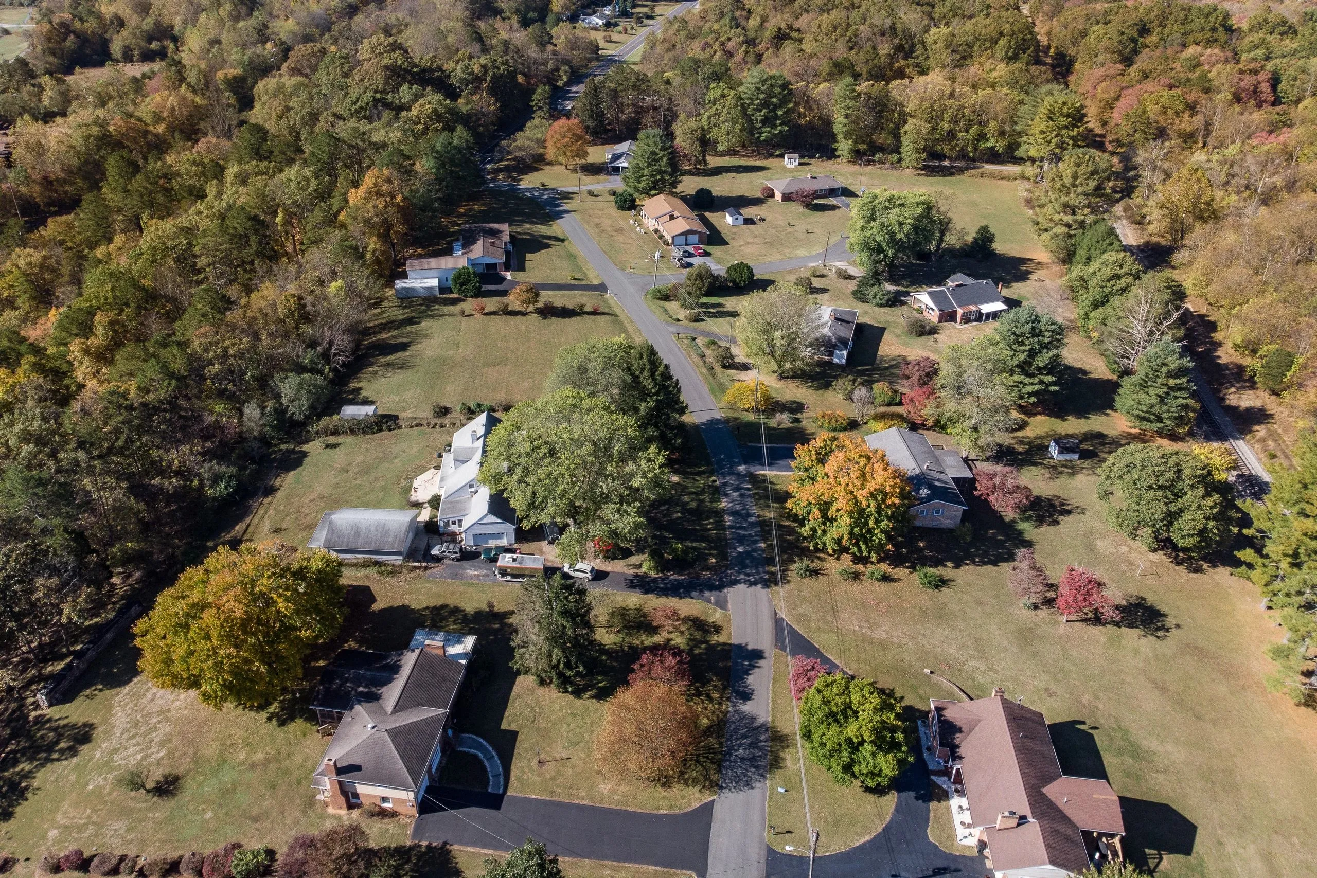 An aerial view of Glasgow's residential streets in autumn, leaves turning across the neighborhoods.